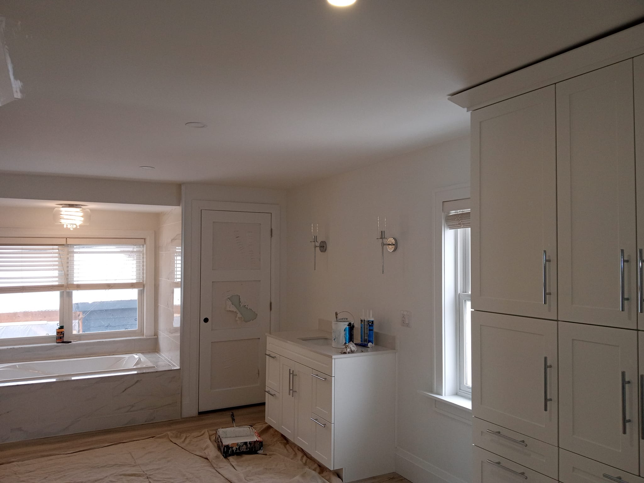Renovated bathroom with white cabinetry and modern fixtures